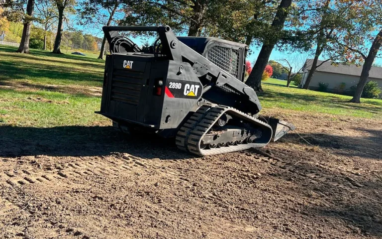 a black bulldozer on dirt