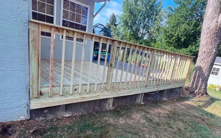 a wooden deck with a swing set