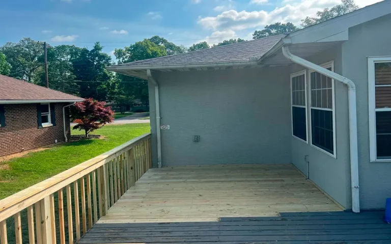 a house with a deck and a yard