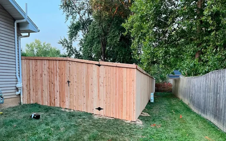 a wooden fence in a yard