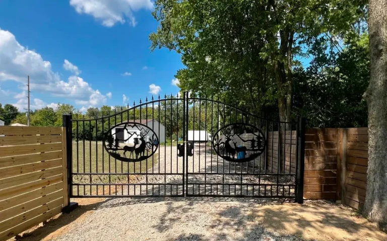 a gate with trees and a fence