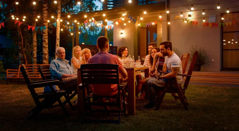 Happy family relaxing in a lush garden, enjoying the results of professional landscaping services and lawn sodding."